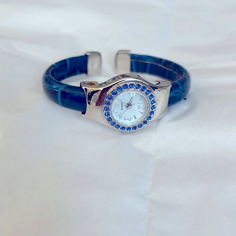 Blue quartz ladies bangled watch.
